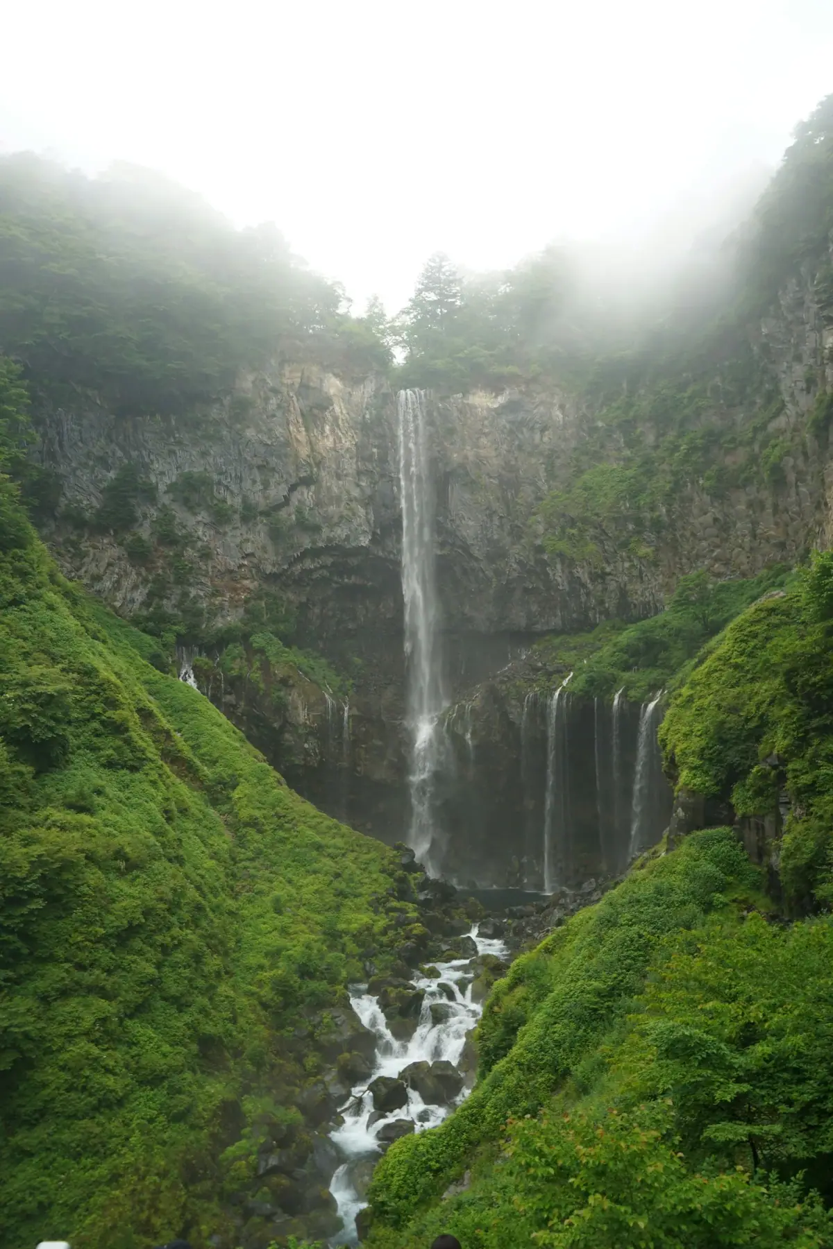 Kegon Falls viewed from the front, framed by rock faces and greenery